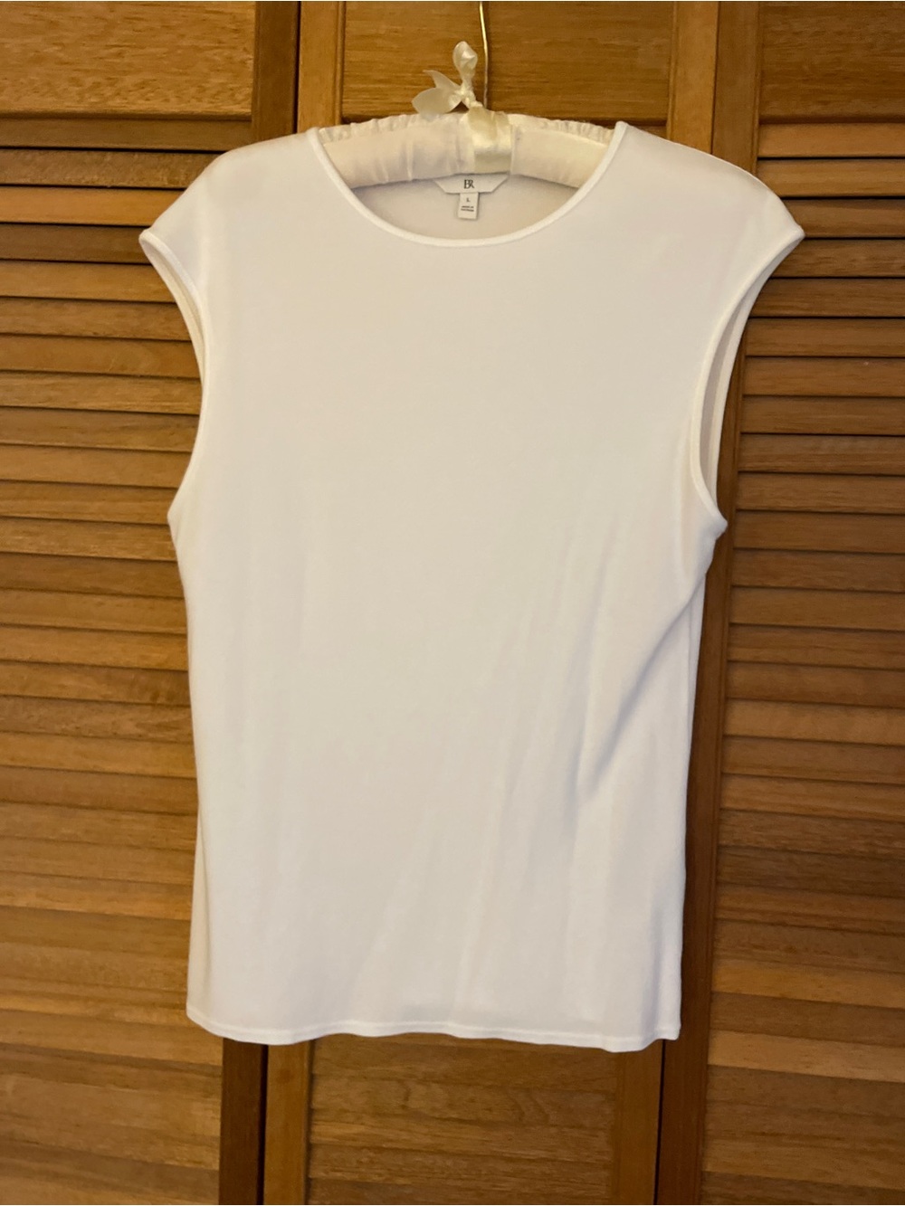 White Sleeveless Crewneck Top.